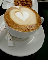 Close-up of cappuccino on table