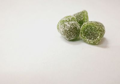 High angle view of candies against white background