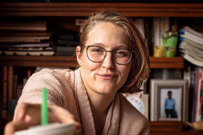 Portrait of smiling young woman at home