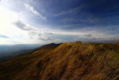 View of landscape against cloudy sky