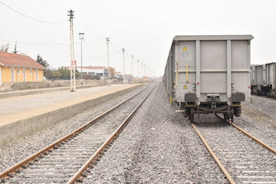 Train on railroad track against sky