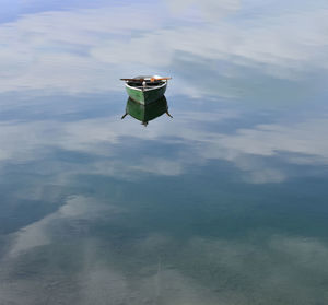 High angle view of boat floating on lake