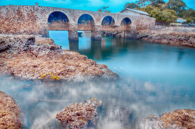 Arch bridge over river