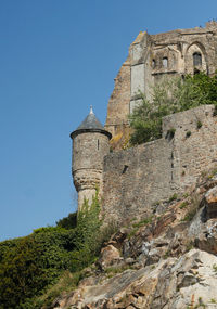 Low angle view of old ruins against clear sky