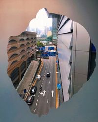 High angle view of street amidst buildings in city