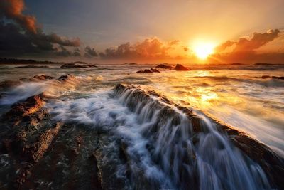 Scenic view of sea against sky during sunset
