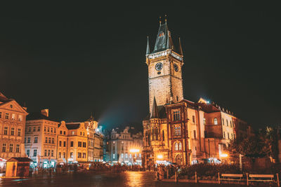 Illuminated buildings in city at night