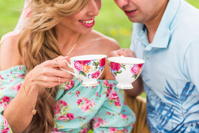 Beautiful young woman drinking glasses