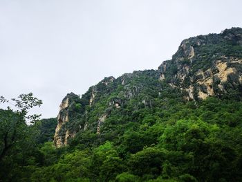 Low angle view of rock formations against sky