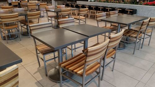 High angle view of empty chairs and tables