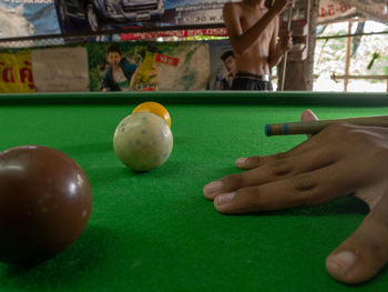 Person playing with ball on table