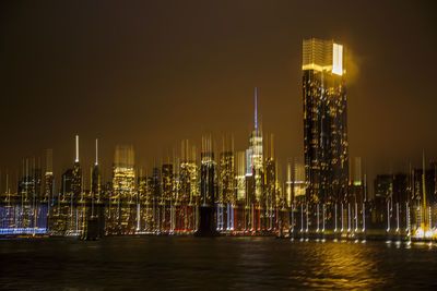 Illuminated buildings in city at night