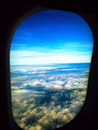 Aerial view of landscape seen through airplane window