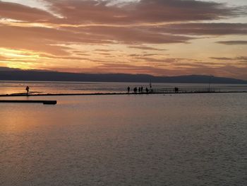 Scenic view of beach against sky during sunset