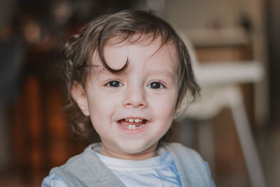 Close-up of cute toddler boy smiling