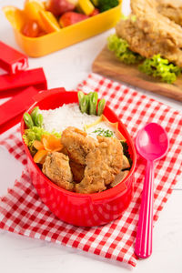 High angle view of food in tiffin box on table