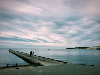 Scenic view of sea against cloudy sky