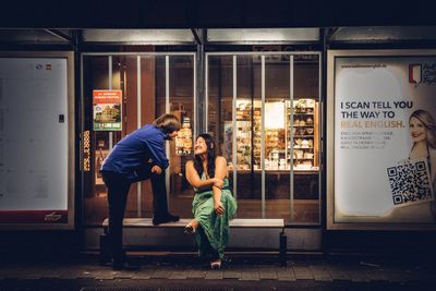 Full length of woman standing on bench