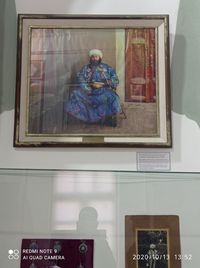 Low angle view of woman by window at home