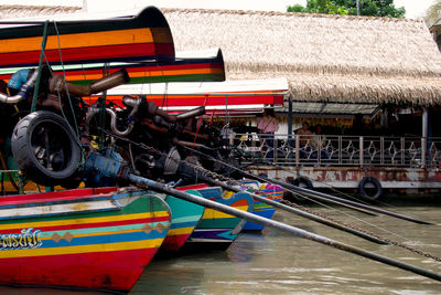 People working on boat in river