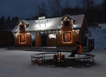 Illuminated traditional building during winter at night