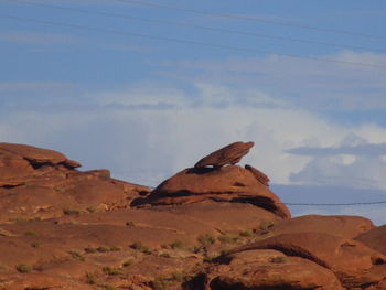 Rock formation on land against sky