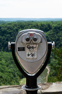 Close-up of coin-operated binoculars against clear sky