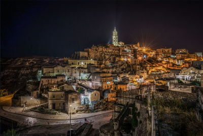 High angle view of illuminated buildings in city at night