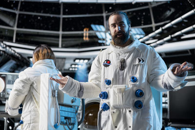 Rear view of scientist working in laboratory