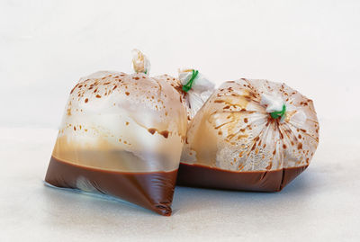 Close-up of cake against white background