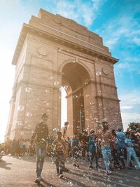 Group of people in front of historical building