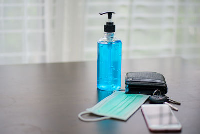 Close-up of blue bottle on table