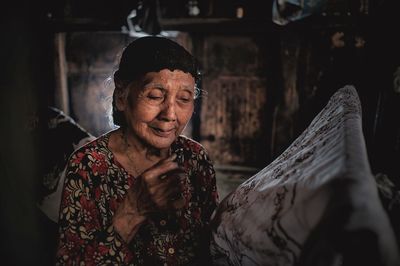 Senior woman holding fabric