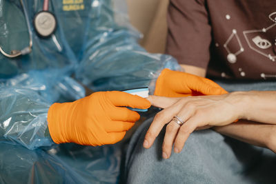 Doctor examining patient at home