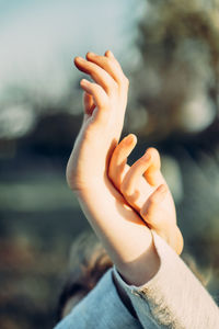 Close-up of person hand on finger against blurred background