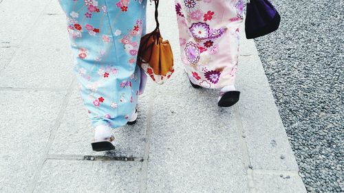 Woman with multi colored umbrella