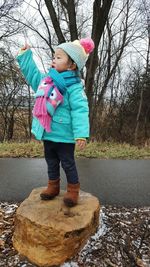 Full length of girl standing in park