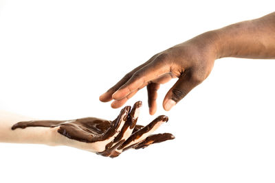 Close-up of hand over white background