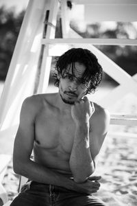 Young man looking at swimming pool