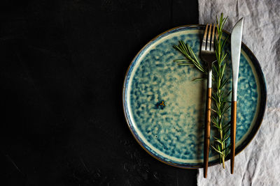 Directly above shot of rice on table against black background