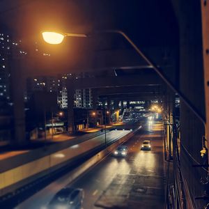 Illuminated city street at night