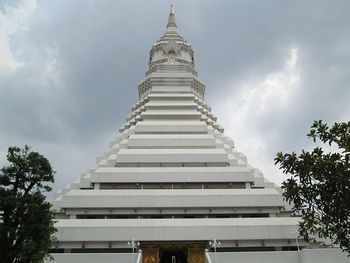 Low angle view of building against cloudy sky