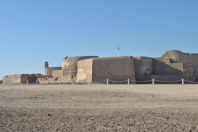 View of fort against clear blue sky