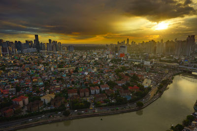 High angle view of buildings against sky during sunset