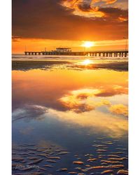 Scenic view of sea against sky at sunset