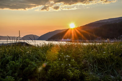 Scenic view of landscape against sky during sunset