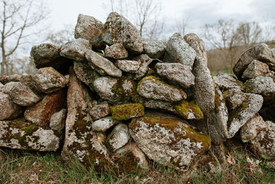 Close-up of stack of rocks on field