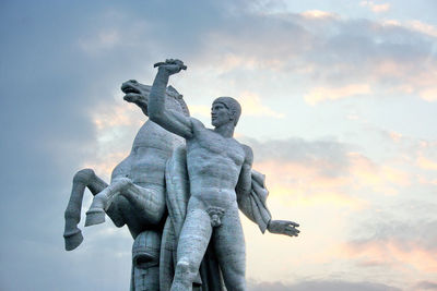 Low angle view of statue against sky