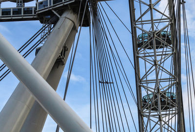 Low angle view of suspension bridge against sky