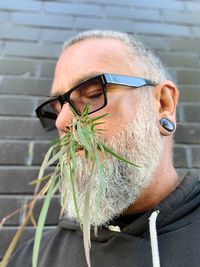 Portrait of man wearing eyeglasses